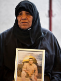 Mother of Gaza with photo of her son : Mother of Gaza in a demonstration for the release of her son in israeli jails