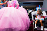 : Sparkle, baby explores girl culture in Australia within the phenomena of beauty pageants, particularly those directed at the young. Through documenting child pageants, I seek to understand if participating in these events increases the pressure on young girls to conform to an idealised view of what it means to be female or rather, is it a celebration of girlhood? It is not about why they compete in child pageants, but rather, who or what in society is telling them to do so?  Whilst from an outsiders perspective pageants may appear unnatural, to the girls participating, pageants are not only fantastical but also mirror the expectations and demands of society, in regards to presentation, and serve as a worthy preparation for later life. A society that believes those who are presented well, who are thinner, or more conventionally beautiful are valued more.  Through allowing me access to their ‘competitive lives’ I have been enabled by these girls to tell their story, not just as...