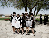 Images from Kazakhstan : Young girls in traditional dress, visiting the Khodja Akhmed Yassaui Mausoleum. Turkestan, Kazakhstan 2014