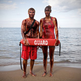 Life Guards : Crude Awakening  ~  Living on the shores of Lake Michigan, I am acutely aware of the disastrous toll the oil spill in the Gulf of Mexico has taken on all forms of life, especially as our beaches opened to the 2010 swimming season. This environmental, social and economic catastrophe highlights a much larger problem that has inflicted untold suffering as we exploit the earth’s resources worldwide.  We are all responsible for leading lives that create demand for unsustainable energy. We are also all responsible for the solution and we must work together to protect the balance of life.