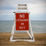 No Life Guard on Duty : Crude Awakening  ~  Living on the shores of Lake Michigan, I am acutely aware of the disastrous toll the oil spill in the Gulf of Mexico has taken on all forms of life, especially as our beaches opened to the 2010 swimming season. This environmental, social and economic catastrophe highlights a much larger problem that has inflicted untold suffering as we exploit the earth’s resources worldwide.  We are all responsible for leading lives that create demand for unsustainable energy. We are also all responsible for the solution and we must work together to protect the balance of life.