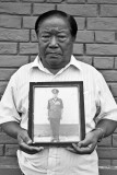Our Gurkhas : Retired inspector As Bahadur Limbu holds up a framed photograph of himself in uniform, taken in his last few years before retirement. The 75-year-old served from 1956 till 1983.