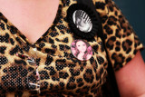 Mary's Pageant : Dana wears photographic pins of her Daughter Mary Brunner, age 8, to show her support during the Darling Divas Candy Land pageant on July 21, 2012 in Brooklyn, New York. Each year as many as 100,000 children under the age of 12 participate in U.S. child beauty pageants, and it has recently become a billion-dollar industry.
