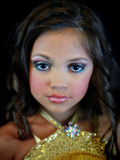 Mary's Pageant : Mary Brunner, age 8, posing for a portrait  during the Angel Face Nationals in Liverpool, New York on October 27, 2012. Each year as many as 100,000 children under the age of 12 participate in U.S. child beauty pageants, and it has recently become a billion-dollar industry.