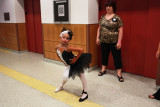 Mary's Pageant : Mary Brunner, age 8, receiving last minute coaching by her mother Dana before performing her Black Swan routine at the Candy Land beauty pageant at the Kimble theatre in Brooklyn, New York on July 21, 2012. Each year as many as 100,000 children under the age of 12 participate in U.S. child beauty pageants, and it has recently become a billion-dollar industry.
