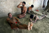 Indian Wrestler : Indian wrestlers exercise beside holy river Ganges in Kolkata, India, May 01, 2006. Kushti is traditional Indian wrestling. It’s not just a sport art, it’s an ancient subculture. Wrestlers live and train together, have their strict rules. They may not drink, smoke and have sex. Their life must be pure. Kushti wrestlers live in gyms called akhara. Their diet consists of milk, eggs, almonds and home made bread called chapatis. Indian traditional wrestling is very popular for keeping strong and healthy body.