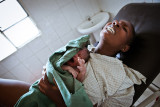 Birth is a dream - Maternity in Africa : A woman is suffering receiving injection for local anesthesia because she needs some sutures after delivering