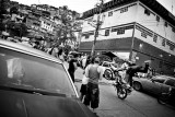 03.- Moto Stunts : Motorcycle stunts perform in the middle of the street in "El Valle". Motorcycles are some of the most coveted objects and their robbery is at the origin of many murders every week.