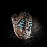 Tennis Shoes : A selection from a personal project about plastic garbage in the ocean.  I wanted to idealize the objects found on the beach, pointing the attention to the fact that after being in between storms, waves and hot sun, these object are still there, partially destroy but still around us. They will not disappear by themselves unsell we decide to take care of our beaches and oceans.