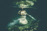 hear strings : bride with guitar under water